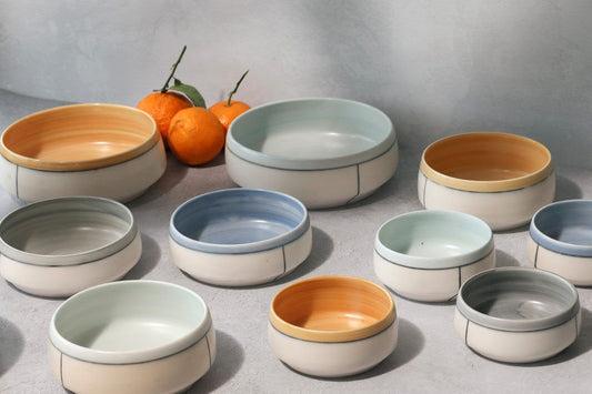 Briggs Shore Ceramics Line & Color Block bowls and votives in 2022 Spring Collection colorways.